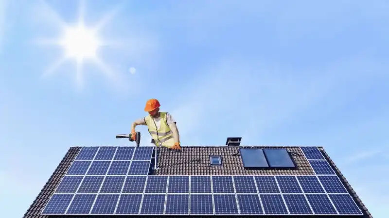 A person Installing solar panel